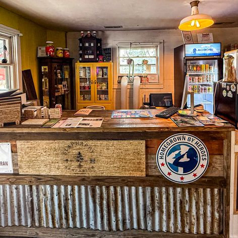 hemporium front desk with drink displays and signage
